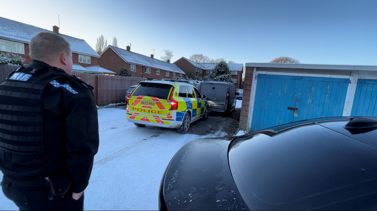 Picture of an officer and a police car after finding the stolen Van in South Staffordshire