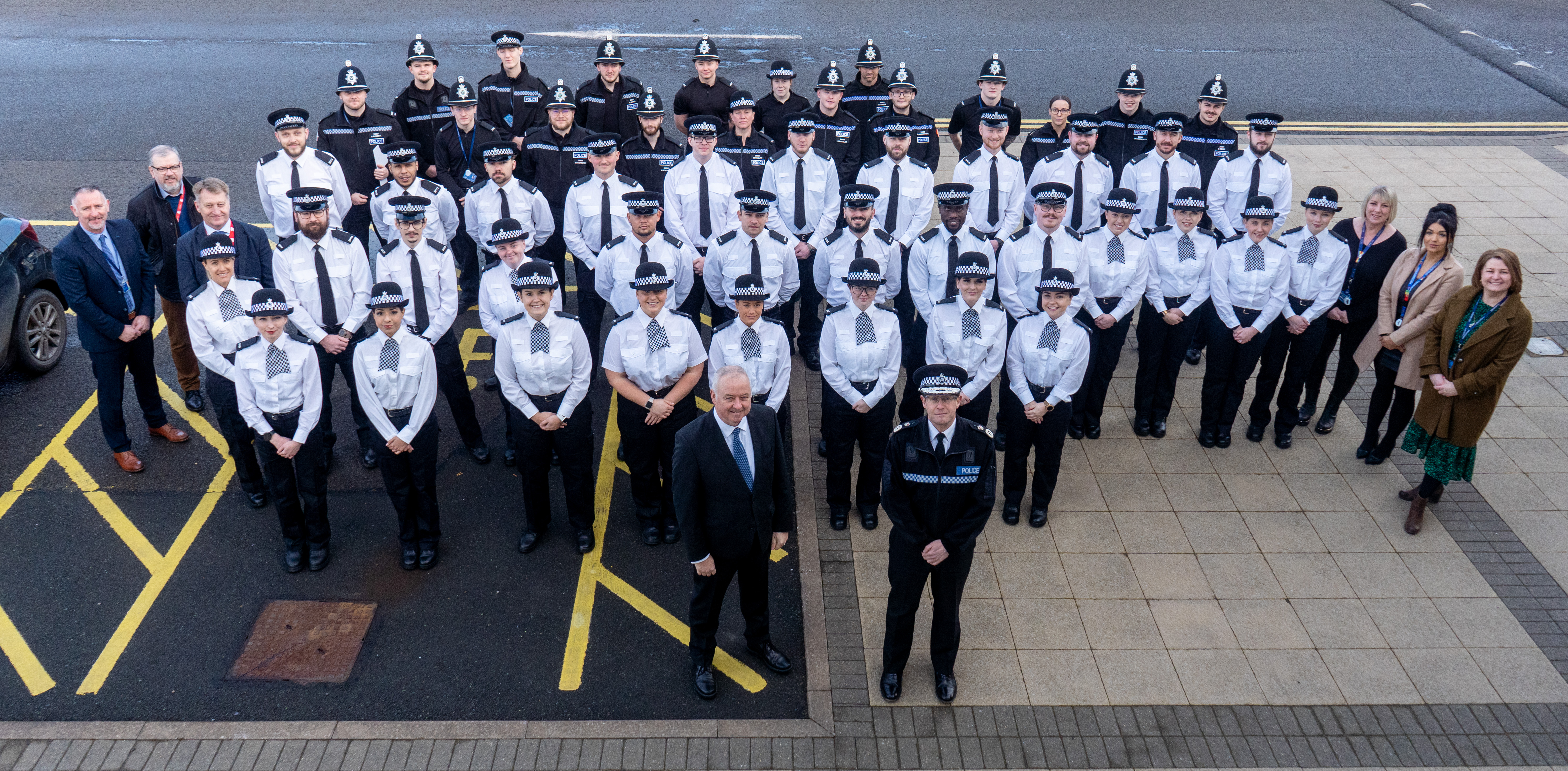 Staffordshire Commissioner for Police, Fire & Rescue and Crime, Ben Adams (front centre left), Chief Constable Chris Noble (front centre right) and uplift officers at HQ 