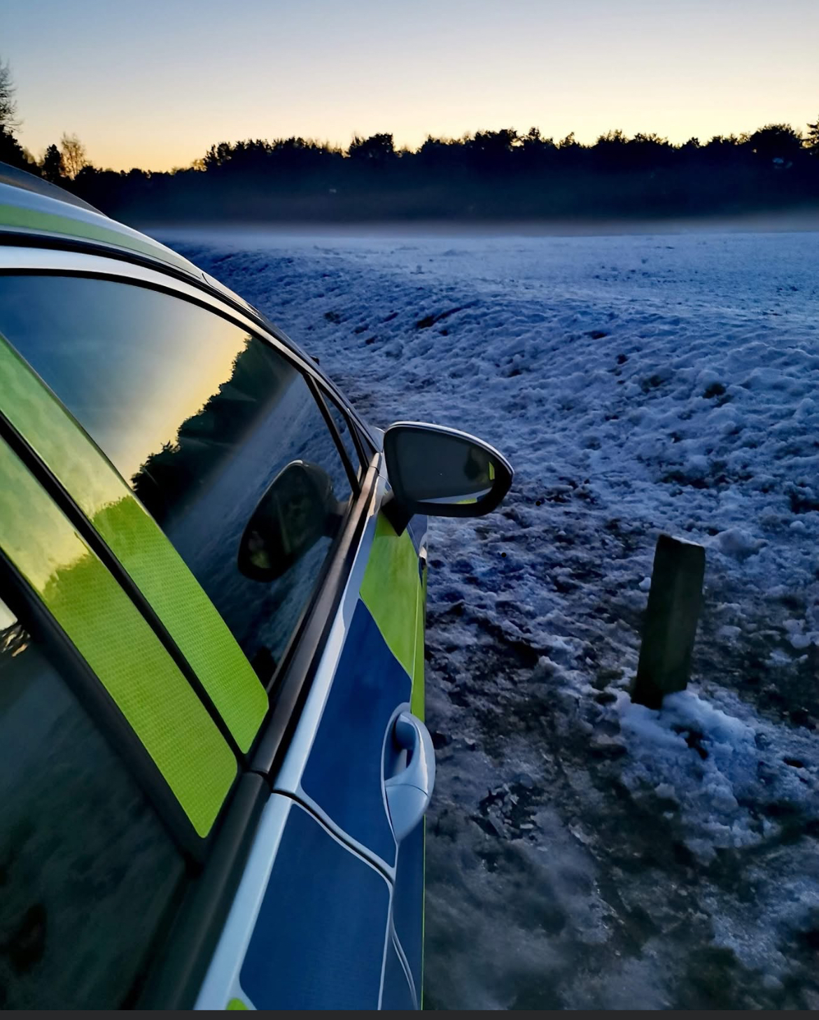 Frosty field and car 