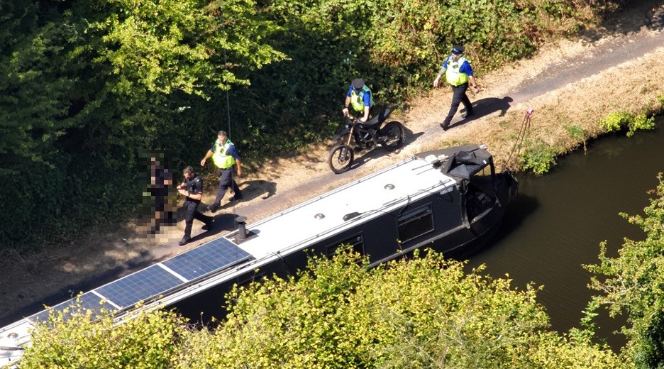 footage from the drone showing officers patrolling a canal