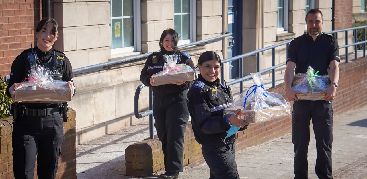 Officers with the hampers
