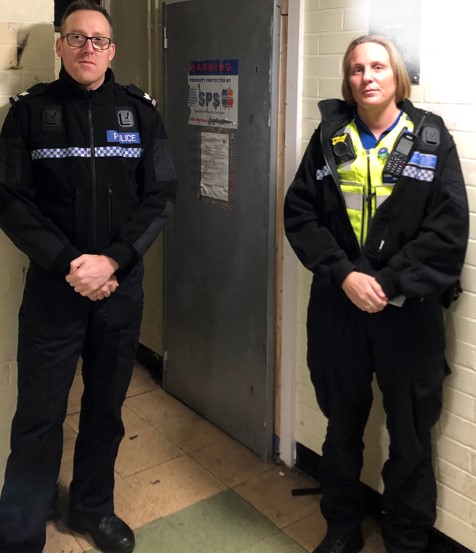 Officers outside closed property